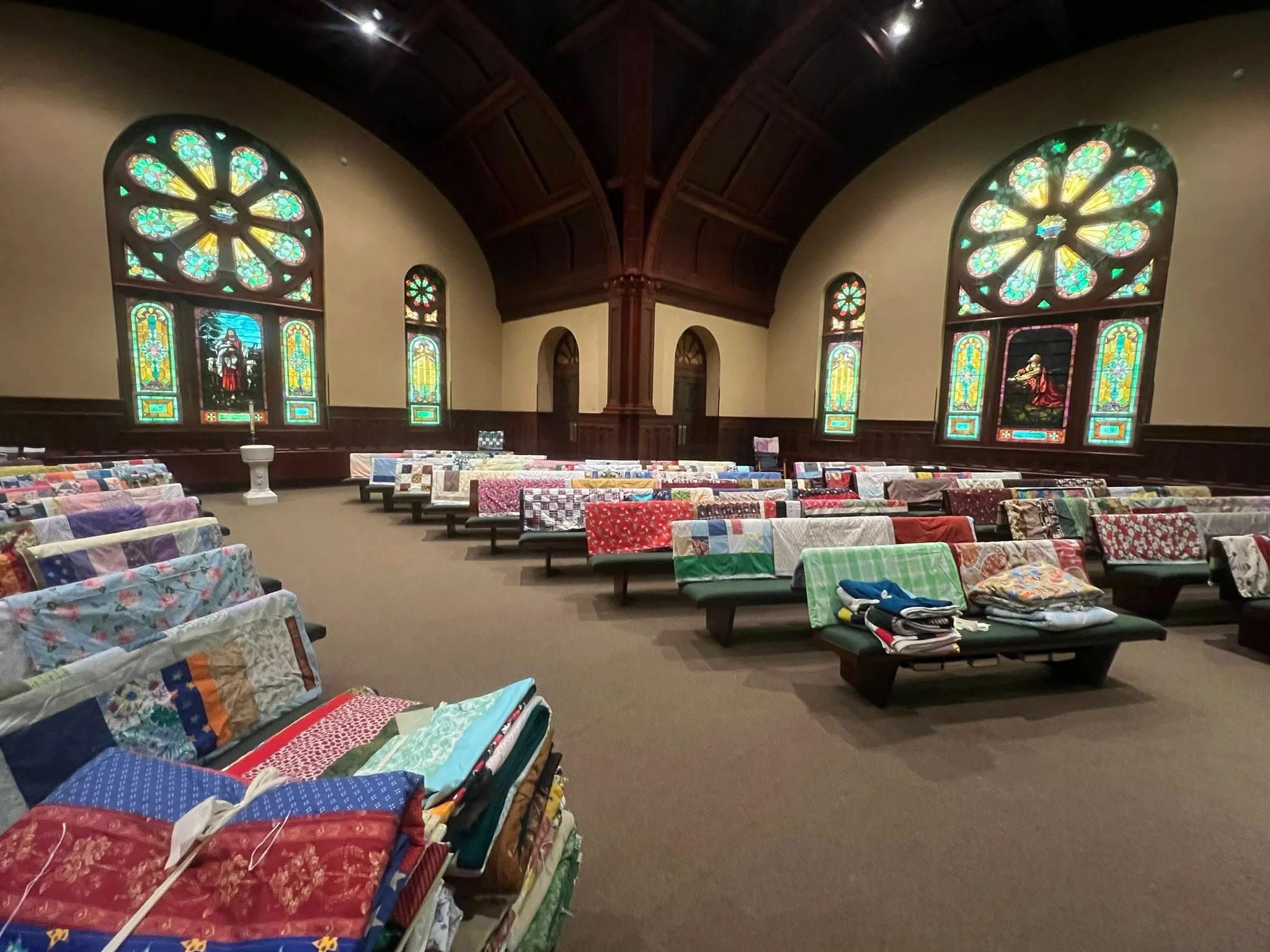 Handmade blankets displayed throughout the sanctuary at Zion Lutheran Church